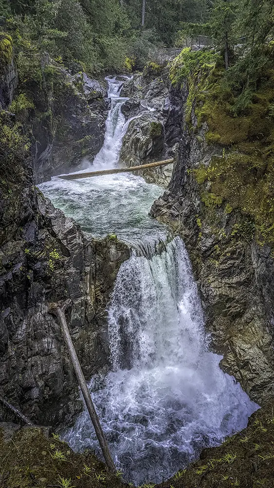 Multi-tier waterfall flowing through rocky canyon captured with iPhone Photography