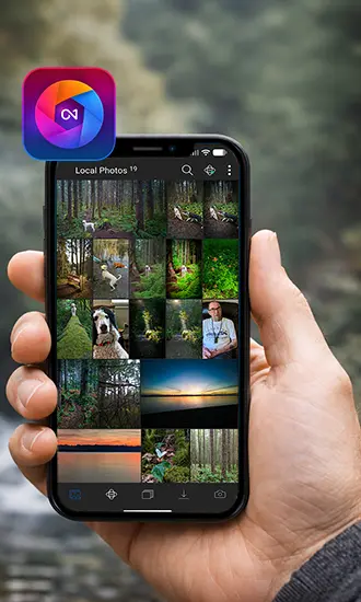 Person holding a smartphone while importing photos into On1 Photo RAW Mobile