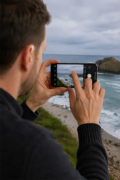 Man checking his phone photo to ensure he's take an sharp photo